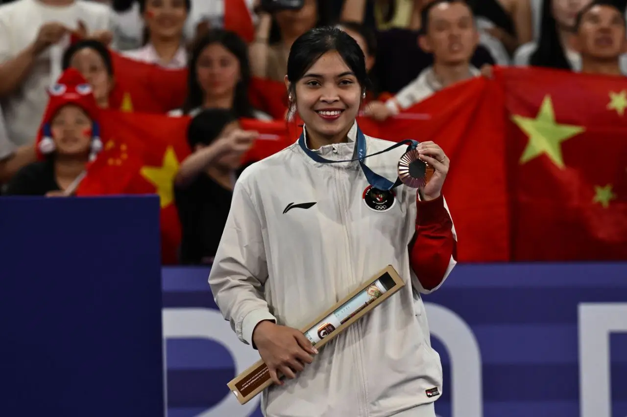 Gregoria Mariska Tunjung sakit cacar air setelah kembali dari Olimpiade Paris 2024. (Foto: NOC Indonesia)